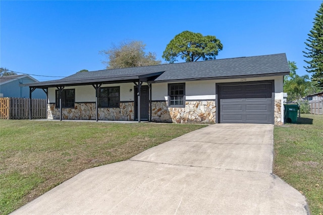 view of front of house featuring an attached garage, a front lawn, fence, stucco siding, and driveway