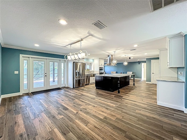 game room featuring baseboards, visible vents, ornamental molding, dark wood-type flooring, and french doors