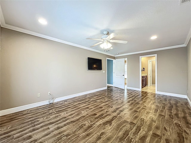 spare room featuring ornamental molding, a ceiling fan, a textured ceiling, dark wood-style floors, and baseboards