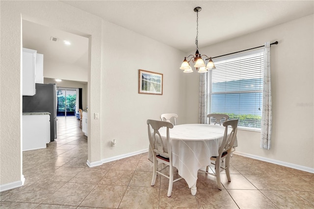 dining room with visible vents, baseboards, and light tile patterned flooring