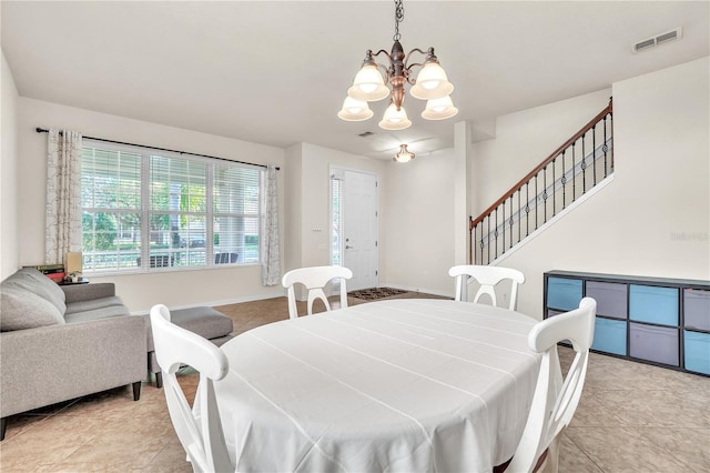 dining room with visible vents, baseboards, stairway, light tile patterned floors, and a notable chandelier