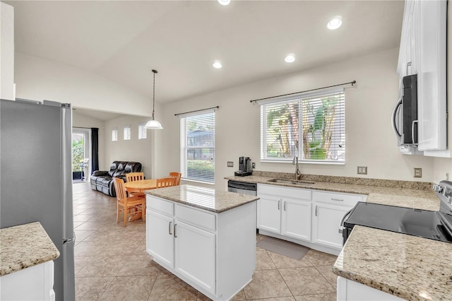 kitchen with a sink, a center island, recessed lighting, stainless steel appliances, and lofted ceiling