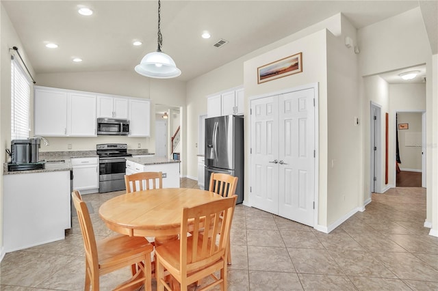 dining area with visible vents, baseboards, lofted ceiling, recessed lighting, and light tile patterned flooring