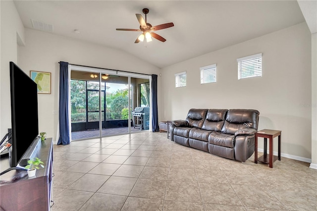 living area with vaulted ceiling, light tile patterned floors, a ceiling fan, and visible vents