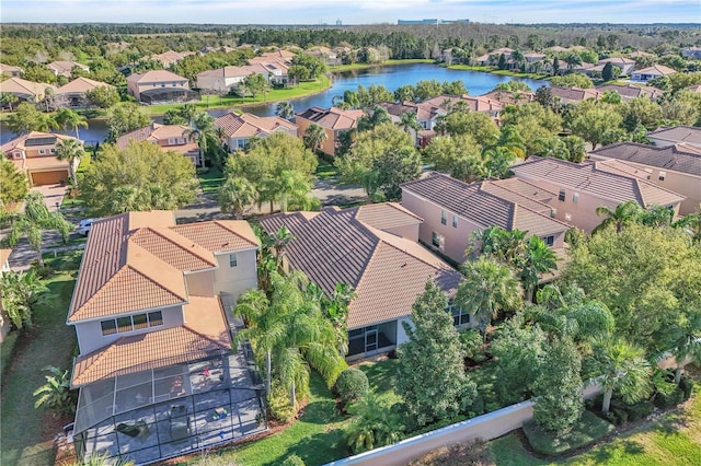 drone / aerial view with a residential view and a water view