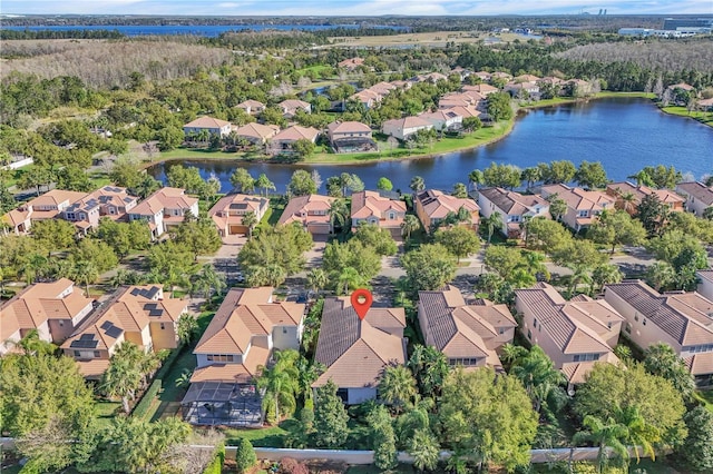 birds eye view of property featuring a residential view and a water view