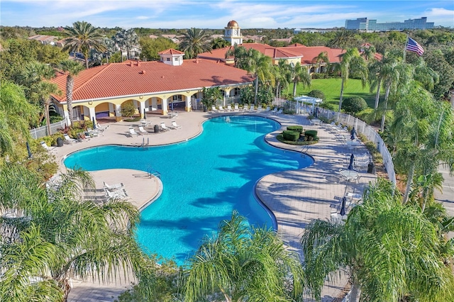 pool featuring a patio and fence