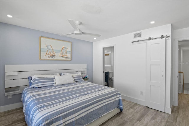 bedroom featuring visible vents, recessed lighting, baseboards, and wood finished floors