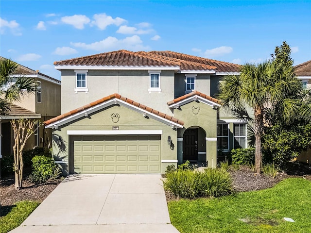 mediterranean / spanish-style house featuring stucco siding, a tiled roof, concrete driveway, and an attached garage