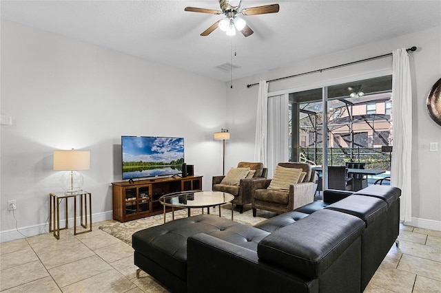 living area featuring a ceiling fan, visible vents, baseboards, light tile patterned flooring, and a sunroom