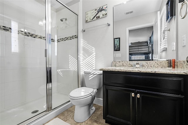 bathroom featuring visible vents, a shower stall, toilet, and vanity