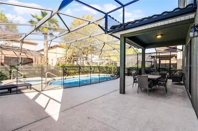 view of patio / terrace featuring an outdoor pool, a lanai, and fence