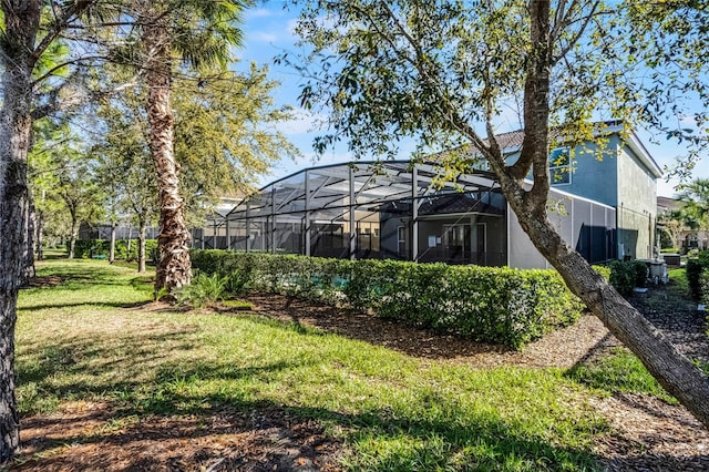 view of yard with a lanai