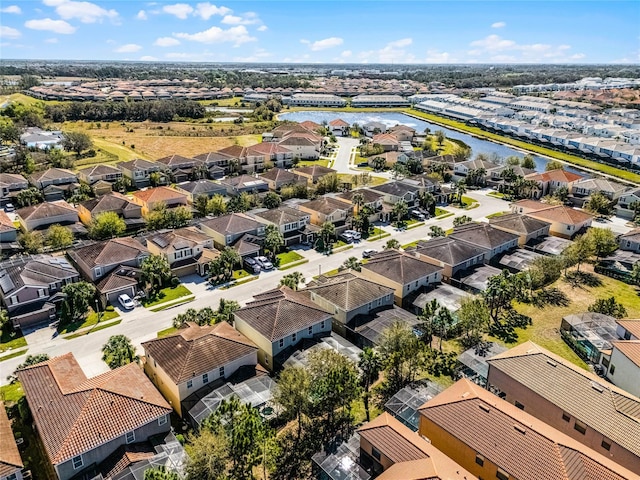 bird's eye view featuring a residential view and a water view