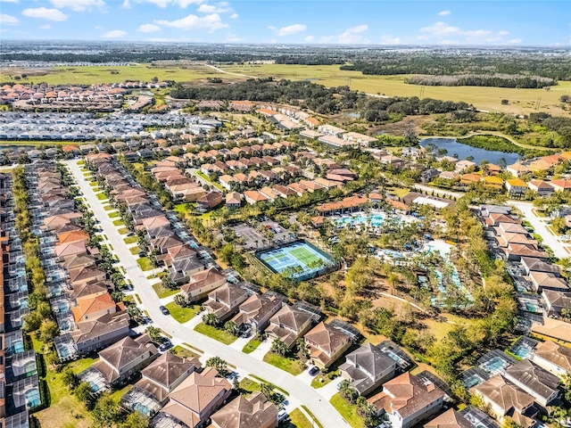 birds eye view of property with a residential view