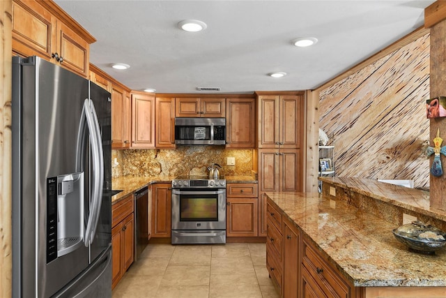 kitchen featuring brown cabinetry and stainless steel appliances