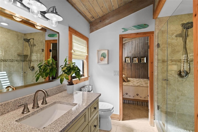 ensuite bathroom with tile patterned floors, a stall shower, toilet, and ensuite bathroom