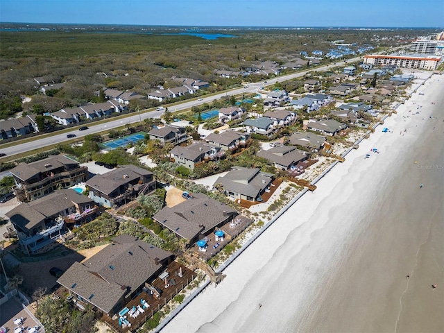 birds eye view of property with a residential view, a beach view, and a water view