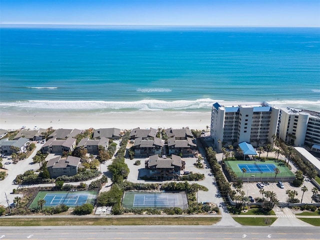 drone / aerial view featuring a view of the beach and a water view