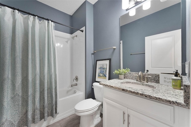 bathroom featuring shower / tub combo with curtain, toilet, and vanity