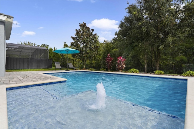 view of pool with a fenced in pool, a patio, and a lanai