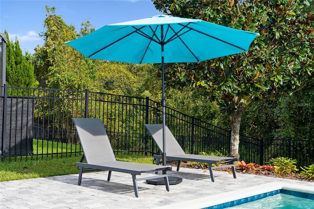 view of patio featuring fence