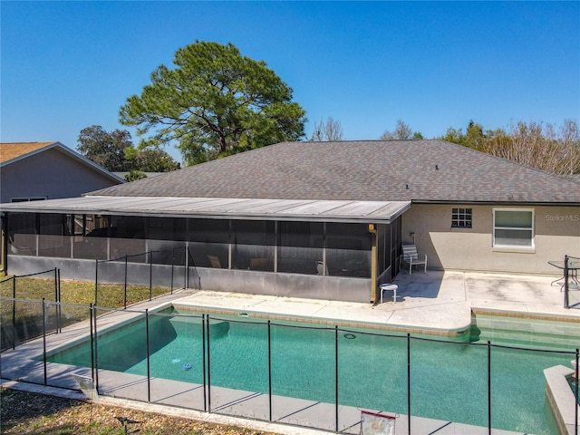 view of swimming pool with a fenced in pool, a patio, fence, and a sunroom