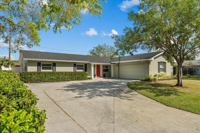 ranch-style house with a front lawn, a garage, driveway, and stucco siding