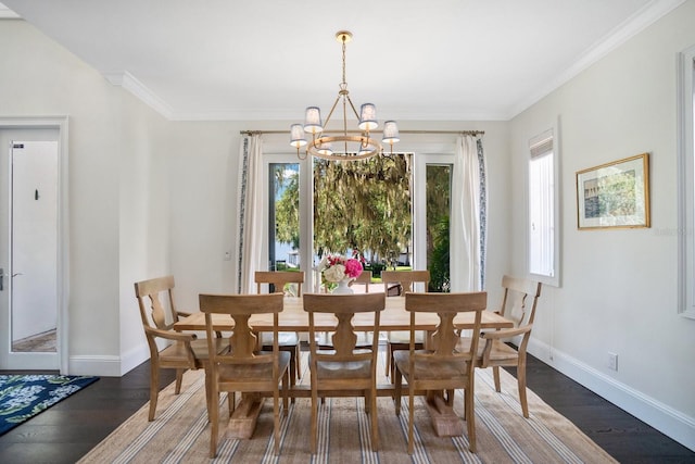 dining area with a notable chandelier, ornamental molding, baseboards, and wood finished floors