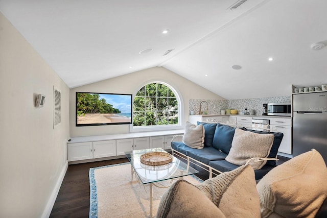 living room featuring baseboards, visible vents, dark wood finished floors, recessed lighting, and vaulted ceiling