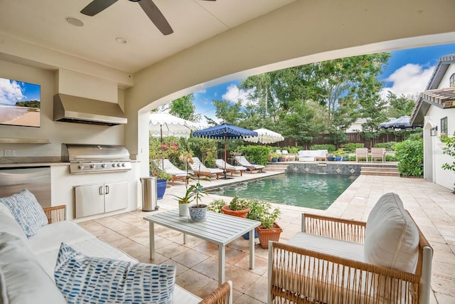 view of swimming pool with an outdoor living space, a patio, a fenced backyard, grilling area, and an outdoor kitchen