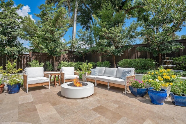 view of patio with an outdoor living space and a fenced backyard