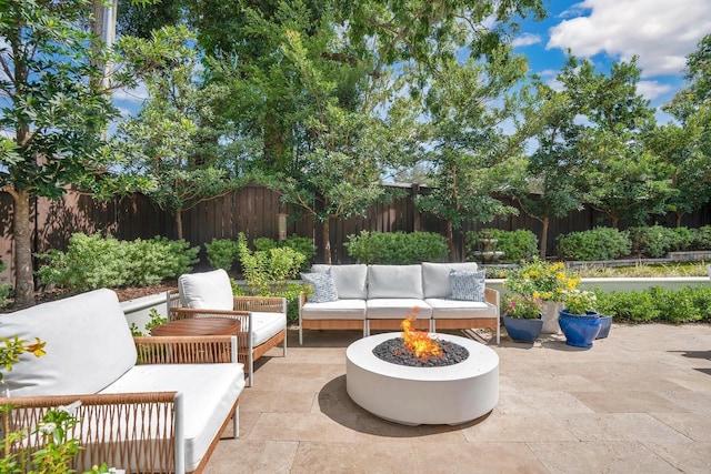 view of patio featuring an outdoor hangout area and a fenced backyard