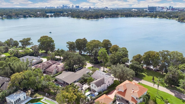 birds eye view of property with a city view and a water view