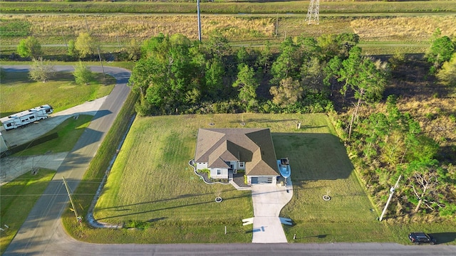 birds eye view of property featuring a rural view