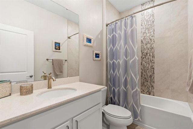 bathroom featuring toilet, vanity, and shower / bath combo