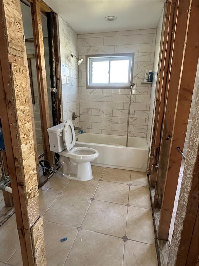 full bath featuring shower / bathing tub combination, toilet, and tile patterned flooring