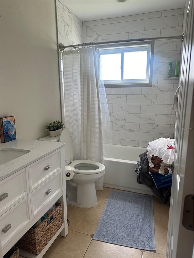 full bath featuring tile patterned floors, toilet, vanity, and shower / tub combo