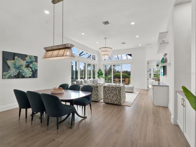 dining room featuring recessed lighting, visible vents, baseboards, and light wood-style floors