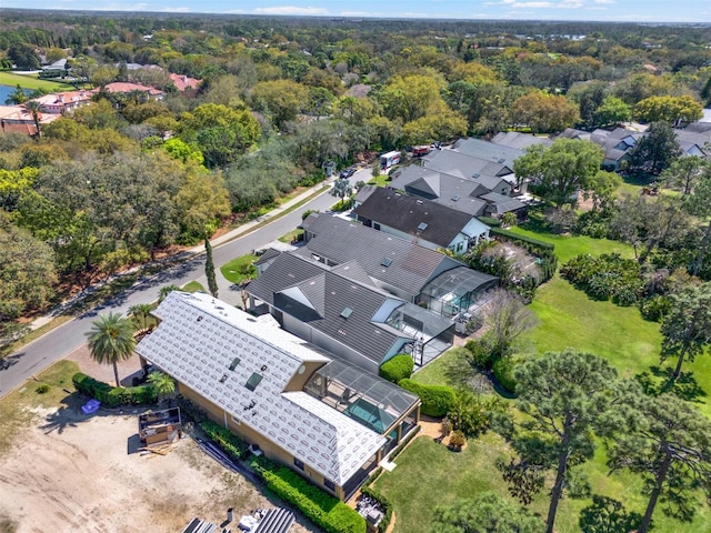 drone / aerial view with a view of trees