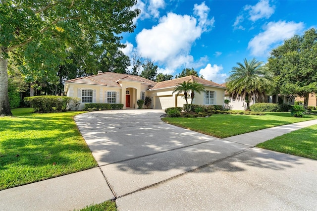 mediterranean / spanish-style house with a front lawn, a tile roof, concrete driveway, stucco siding, and an attached garage