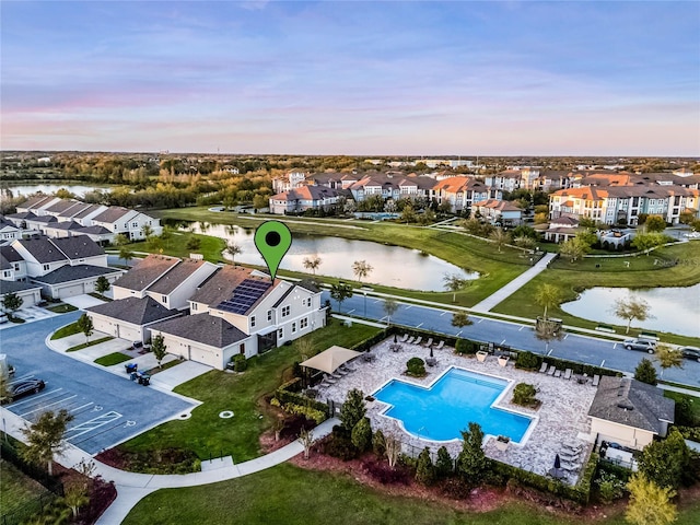 birds eye view of property featuring a residential view and a water view