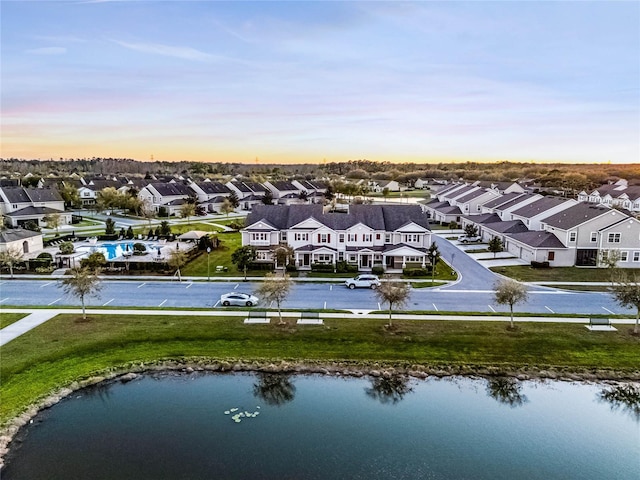 bird's eye view with a residential view and a water view