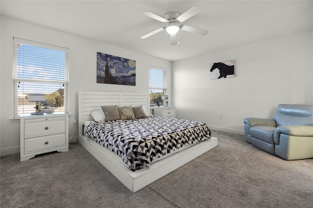 carpeted bedroom with a ceiling fan and baseboards