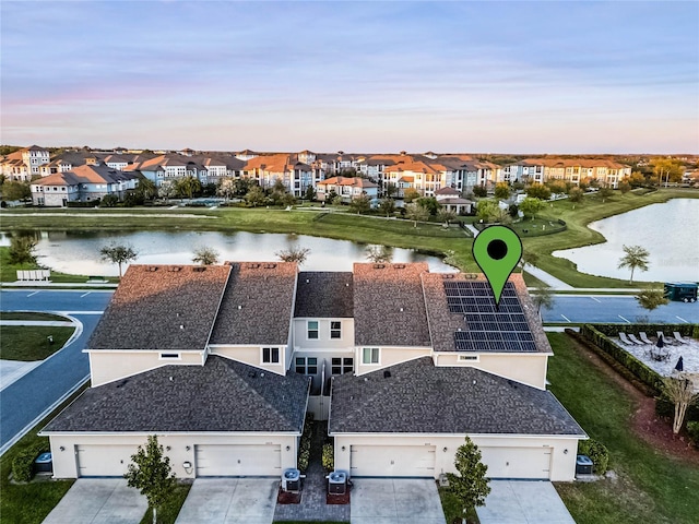 aerial view with a residential view and a water view