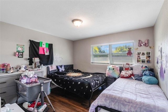 bedroom with wood finished floors