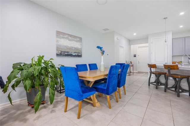 dining area with light tile patterned floors, visible vents, recessed lighting, and baseboards