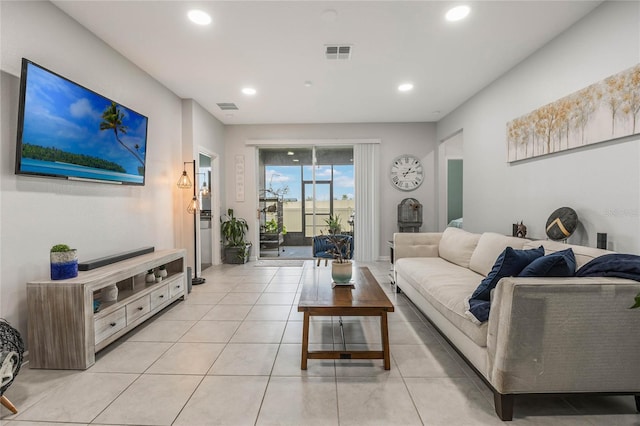 living room featuring light tile patterned floors, visible vents, and recessed lighting