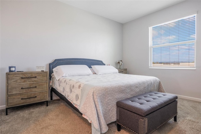 carpeted bedroom with baseboards