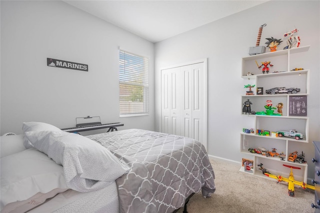 bedroom featuring a closet, carpet flooring, and baseboards